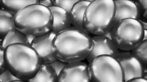 Stacked Silver Metal Eggs Loop