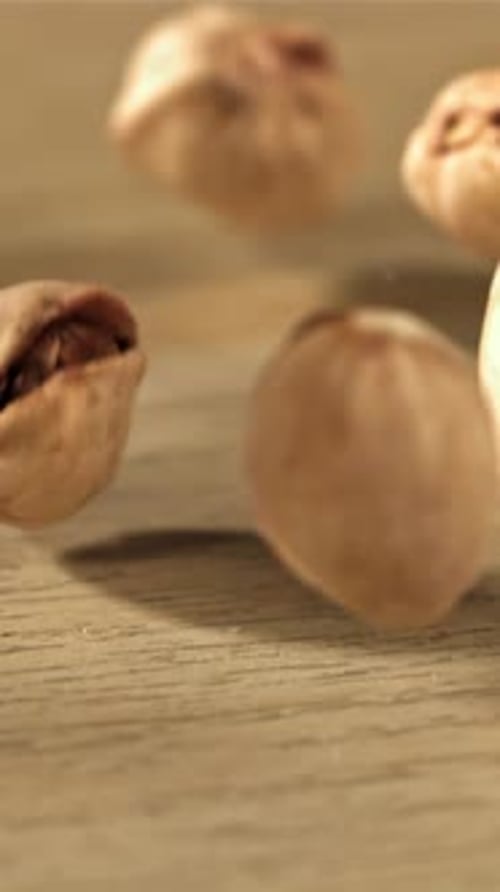 The Pistachios Fall on the Table Filmed on a Highspeed Camera at 1000 Fps