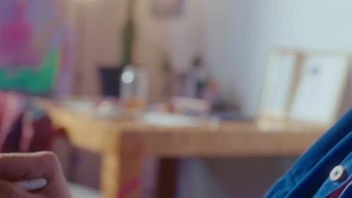 Artist Drawing on Tablet with Stylus Indoors