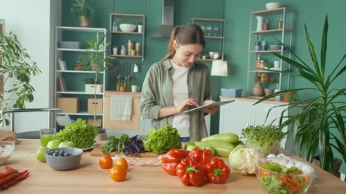 Woman With Tablet Surrounded by Healthy Fresh Produce