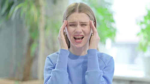 Portrait of Casual Young Woman with Headache, Migraine