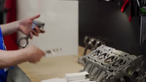 Professional Mechanic Assembles Engine with Care Installing Pistons Rings Liners in Workshop Auto