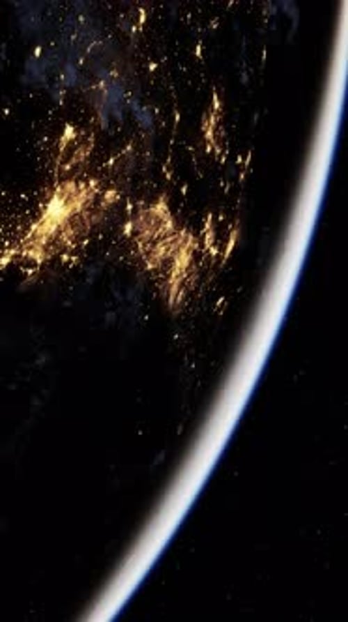 Planet Earth Rotating at Night with Glowing City Lights