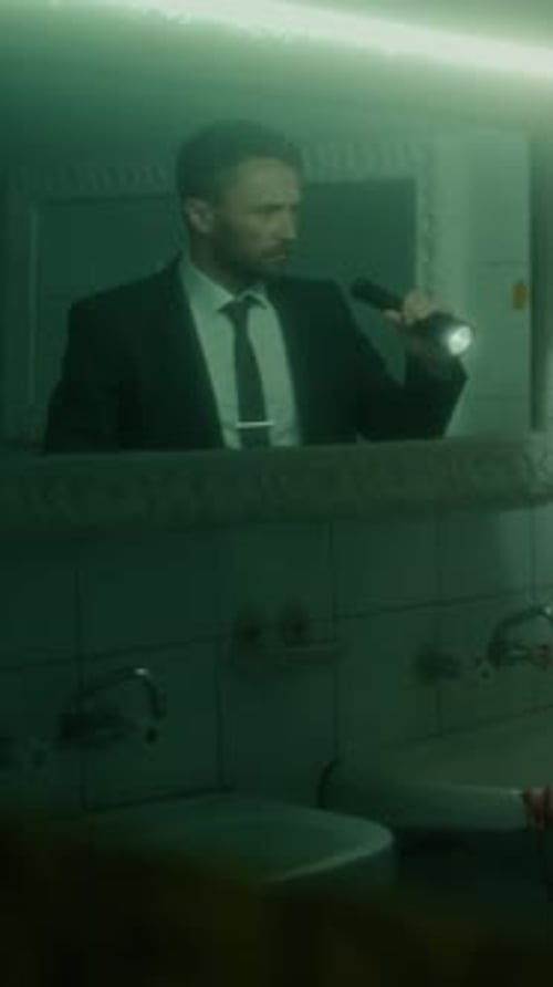 Detectives Investigating Grim Crime Scene in Bathroom