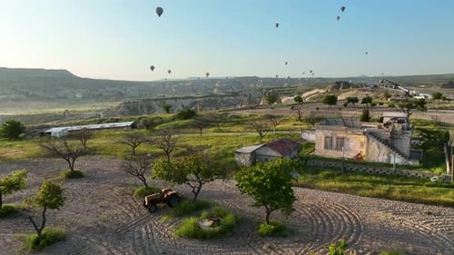 Hot Air Balloons Fly Over the Mountainous Landscape of Cappadocia Turkey