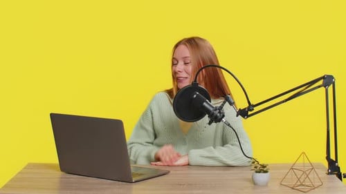 Woman Blogger Influencer Recording Podcast Giving Workshop Webinar Speaking in Microphone and Laptop