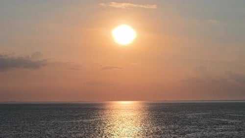 Ground Level Ocean Sunset Over Open Sea Horizon