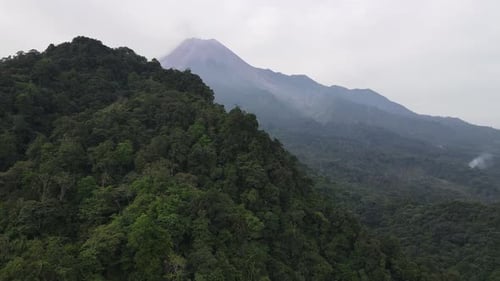 Aerial view of Merapi Mountain in indonesia with tropical forest around it