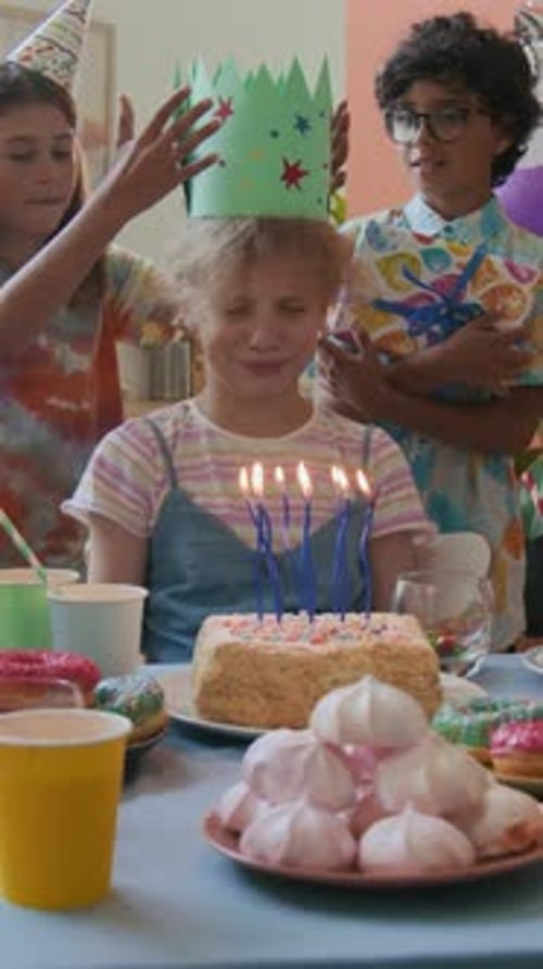 Children Celebrating a Birthday Party with Cake