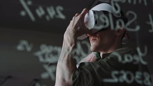 Man Using VR Headset and Remote Controller at Work in Office