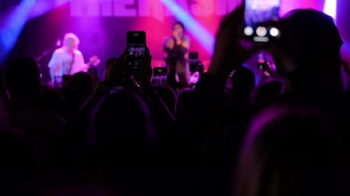 Concert Crowd Records Band Performance on Smartphones