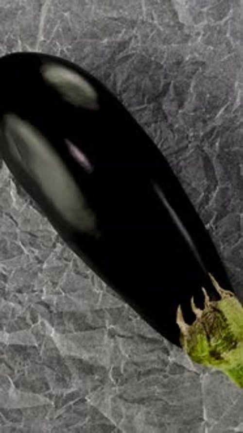 Plump Eggplants Placed on Crinkled Baking Paper Ideal for Cooking Video