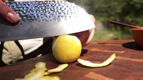 Chef Slices Lemon Peel From a Lemon