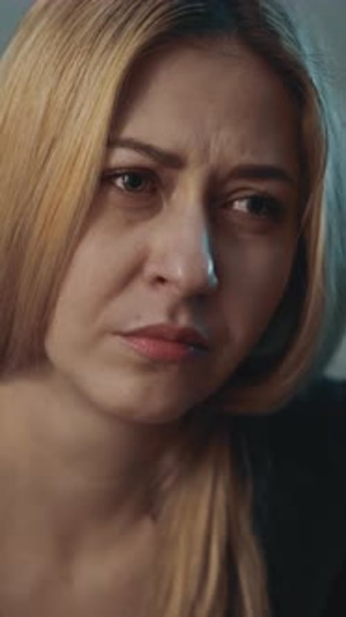 Blonde Woman Suffers From Depression and Stress in Room