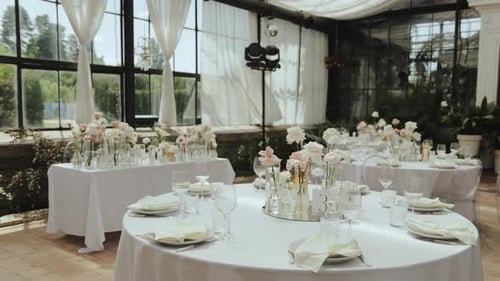 Restaurant Set Up with Tables at the Wedding Chairs and Linens for a Wedding Reception