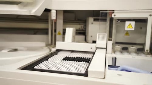 Laboratory Machine Analyzing Samples in Vials