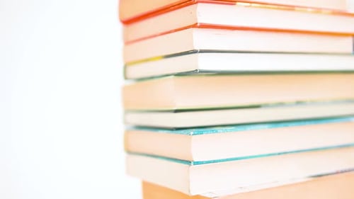 Books are at the stake. From slow and smooth movement to fast movement from the edge of the books to