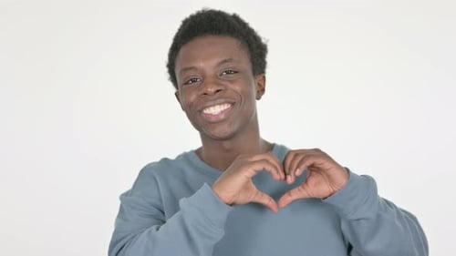 Young Adult Making Heart Shape With Hands
