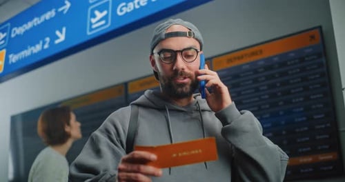 Airport Terminal Male Passenger Holding Plane Ticket Talking By Phone