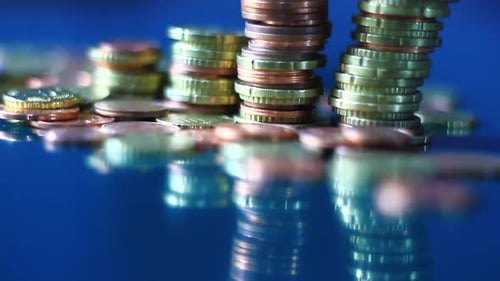 Tilting Stack of Gold and Copper Coins