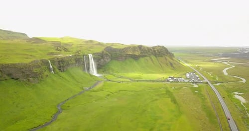 Aerial view of Large waterfall with green landscape in Iceland