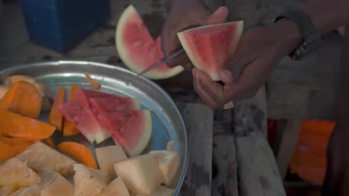 Cutting Watermelon with Tropical Fruit Selection