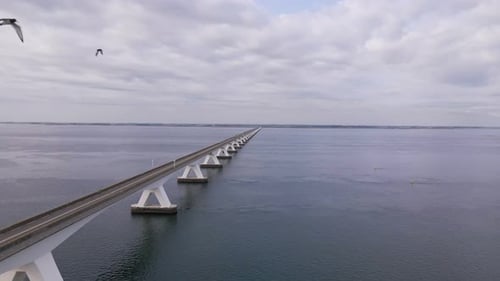 wide aerial view over the full length of the enormous Zeeland bridge in the Netherlands