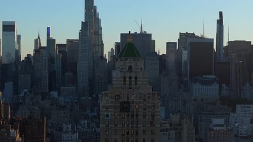 Sunrise Envelops New York City Skyline Casting a Warm Glow Over Midtown Manhattan's Skyscrapers