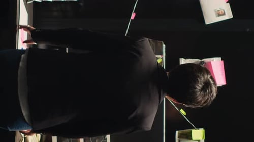 Person Gestures at Crime Investigation Board