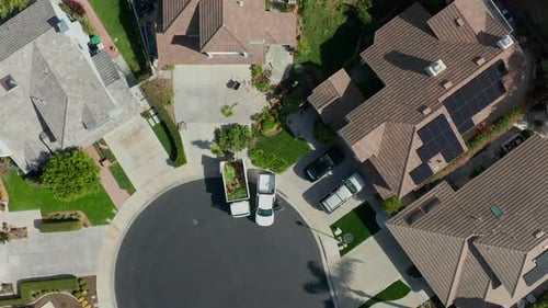 Aerial view of landscapers working in a residential neighborhood