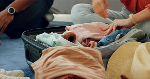 Hands, luggage and travel with a woman packing clothes for a trip, holiday