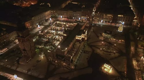 Aerial View of a Snowy City at Night