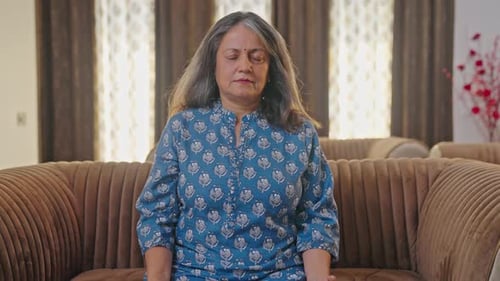 Calm Woman Meditating Peacefully at Home