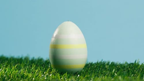 Rotating Painted Easter Eggs on Green