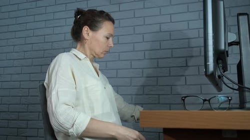 Woman Taking Break from Computer with Eye Treatment