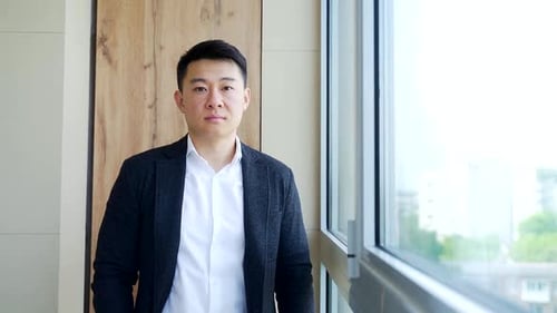 portrait of an Asian business confident male office worker or entrepreneur. A man businessman