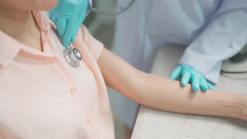 Doctor Examines Patient with Stethoscope During Hospital Visit