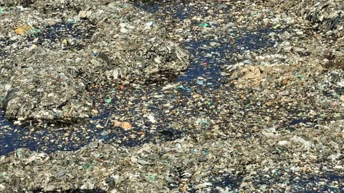 Aerial drone view of a massive waste pile.