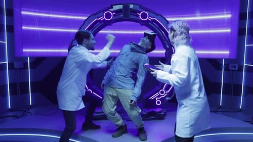 Young Man Experiencing Augmented Reality Effects While Scientists Recording the Data