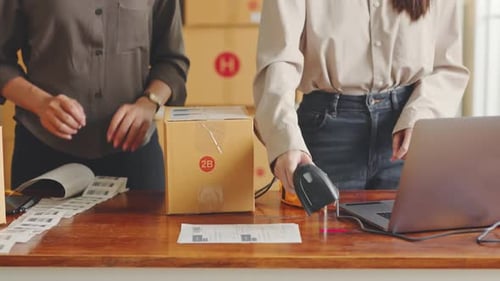 Workers Packing Shipping Box at Warehouse for Delivery