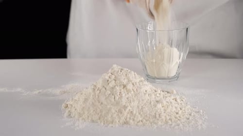 Flour Poured Into Glass For Baking Ingredient