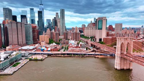 Flying closer to the waterfront of New York where the Brooklyn Bridge starts.