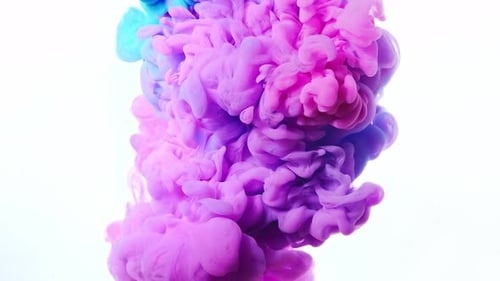 Colorful Ink Swirling in Water on White Background