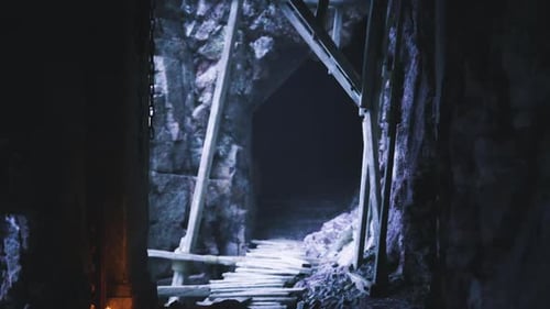 Dark Tunnel with Wooden Supports Leading Into Mysterious Depths
