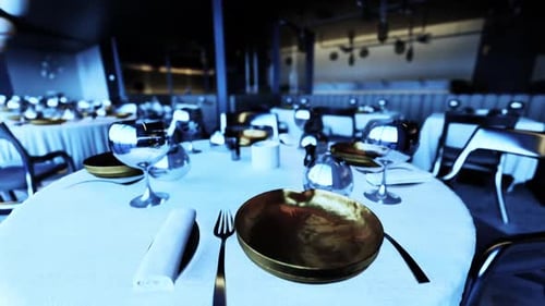 Elegant Dining Setup in an Empty Restaurant Ready for Guests at Night