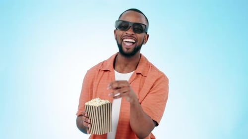 Man, 3d movie glasses and studio with popcorn, laugh and funny comedy by blue background