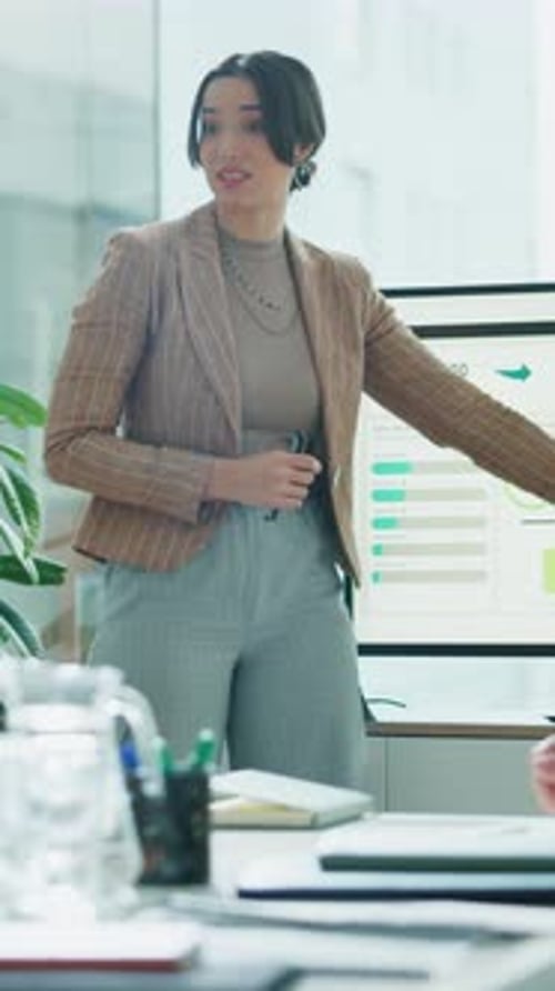 Businesswoman Giving Presentation at Modern Office Meeting
