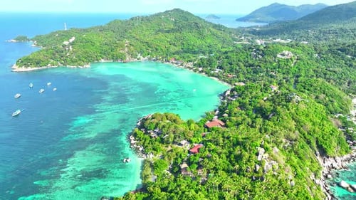 Drone aerial view captures stunning island. 4K.