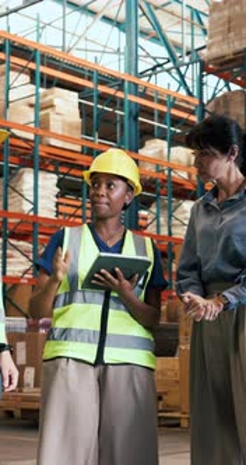 Logistics, group and woman with tablet, warehouse and discussion with colleagues for stock delivery
