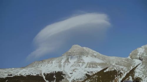 Scenic View of Cloud Over Snowcapped Mountains Adventure